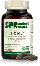 Load image into Gallery viewer, Image of E-Z Mg bottle next to tablets of magnesium supplements.